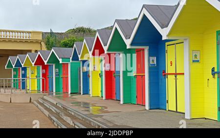 Multicoloured Barry Island beach huts for hire / rent , Barry, looking over Whitmore Bay, Vale Of Glamorgan, Wales, Cymru, UK, CF62 5DA Stock Photo