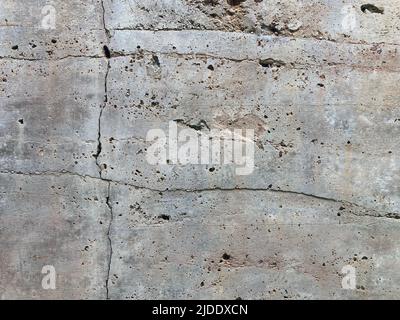 Concrete Wall - Texture of Old Cracked Rough Concrete Wall for Background. Stock Photo