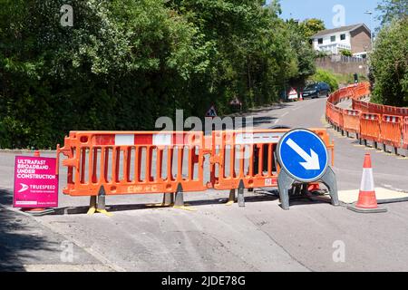 UK housing estate footpaths are closed and dug up whilst work goes ahead to update the estates homes to ultra fast broadband and digital phone lines Stock Photo