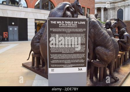 London, UK. 20th June 2022. A new public artwork created by artists Gillie and Marc, entitled The Wild Table Of Love, has been unveiled at Paternoster Square next to St Paul's Cathedral. A bronze sculpture featuring 10 endangered species enjoying a banquet, the bronze artwork aims to raise awareness, funds and support for endangered animals worldwide, and includes two empty seats inviting people to take a seat with the animals. Credit: Vuk Valcic/Alamy Live News Stock Photo