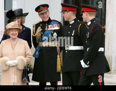 File photo dated 12/4/2006 of Queen Elizabeth II, The Duchess of Cornwall, Duke of Edinburgh, Prince William at Prince Harry at Sandhurst Royal Military Academy after The Sovereign's Parade that marked the completion of Prince Harry's Officer training. The Duke of Cambridge celebrates his 40th birthday on Tuesday. Issue date: Monday June 20, 2022. Stock Photo