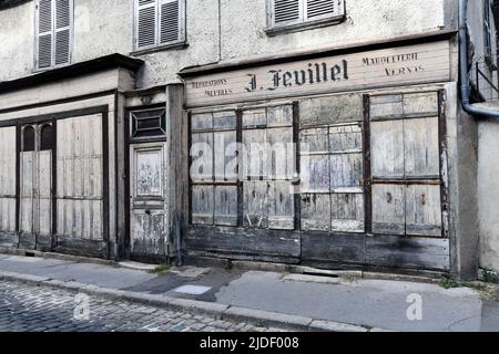 The old shop front of J. Feuillet on Rue de la Porte Jaune in Bourges, France. Stock Photo