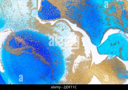 Alcohol-based ink texture in blue tones with gold. Copy space. Stock Photo