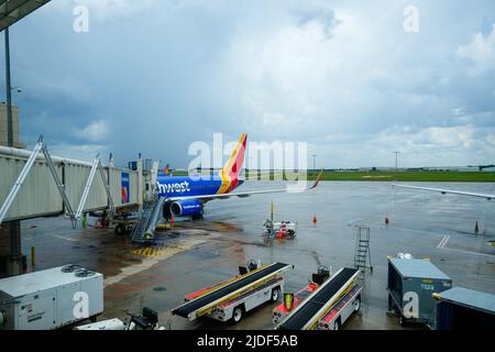 Stock images of South West Airlines at airport gate during weather delays. Airplane at gate in service. Stock Photo