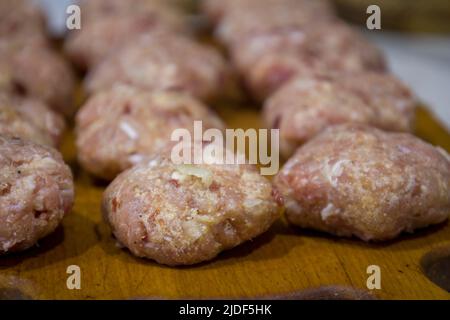Raw meatballs on the board Stock Photo