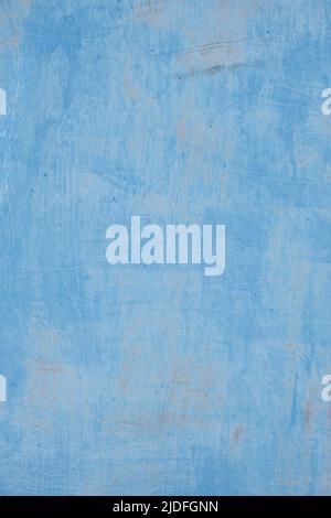 Background is sheet of metal painted with old peeling blue paint Stock Photo