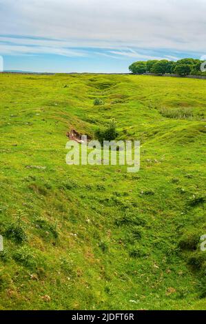 Hollows and hillocks on the old mineral vein of Faucet (Foreside) Rake, scene of many large lead mines, near Rowter Farm in Castleton, Peak District. Stock Photo