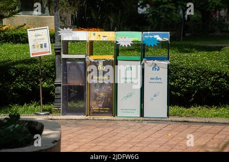 BANGKOK ,THAILAND - JUNE 9 , 2022 :  Garbage bins are arranged neatly and beautifully, easy to sort into different types. in Benjasiri public park. Stock Photo