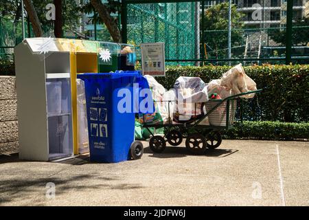 BANGKOK ,THAILAND - JUNE 9 , 2022 :  Garbage bins are arranged neatly and beautifully, easy to sort into different types. in Benjasiri public park. Stock Photo