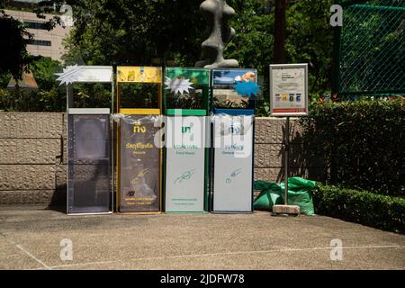 BANGKOK ,THAILAND - JUNE 9 , 2022 :  Garbage bins are arranged neatly and beautifully, easy to sort into different types. in Benjasiri public park. Stock Photo