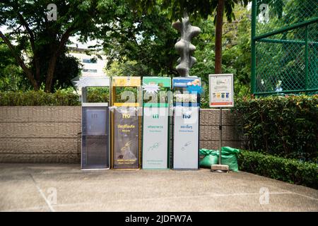 BANGKOK ,THAILAND - JUNE 9 , 2022 :  Garbage bins are arranged neatly and beautifully, easy to sort into different types. in Benjasiri public park. Stock Photo