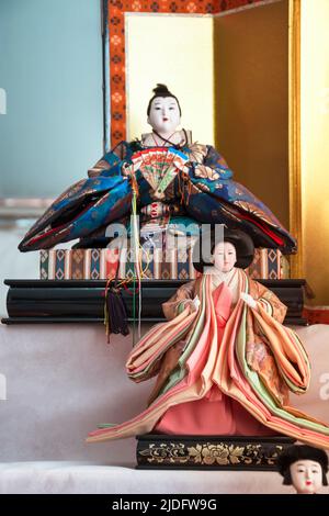 Traditional Japanese dolls with beautiful ornaments and colorful fabrics. Japanese dolls are an essential element of the nation's culture, there is ev Stock Photo