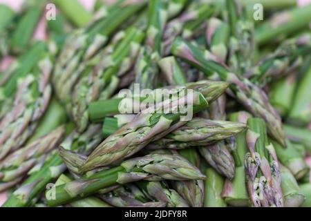 raw green chopped asparagus closeup selective focus Stock Photo