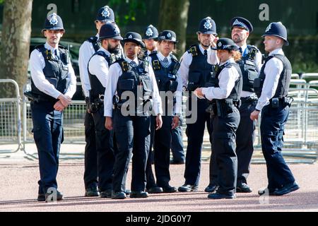 Police officers in a group at the Trooping the Colour Rehearsals, The Mall, London England, United Kingdom, Saturday, May 21, 2022. Stock Photo