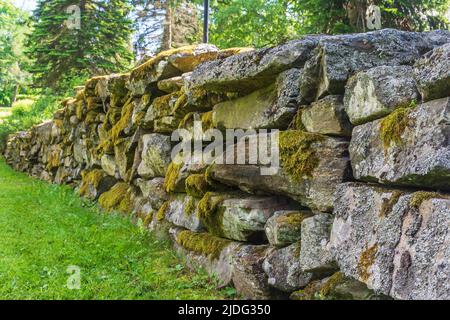 Old stone wall around the medieval stone church in Messukylä Tampere Finland Stock Photo