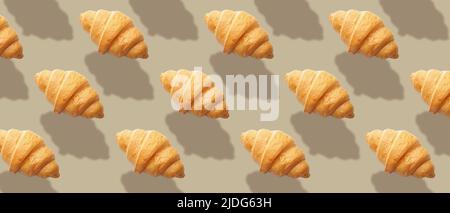 Many fresh croissants on grey background. Pattern for design Stock Photo