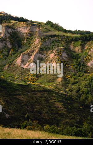 Eroded hills in Montespino, near Pesaro and Urbino in Italy, at evening before the sunset Stock Photo
