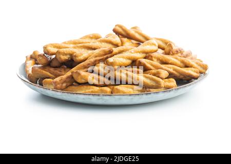 Salted pretzel sticks. Salted crackers isolated on a white background. Stock Photo