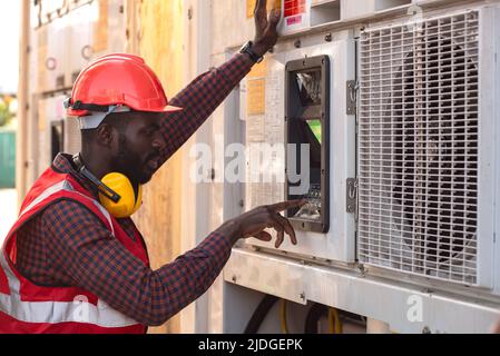 Engineer control reefer with air conditioner at Container box. Stock Photo