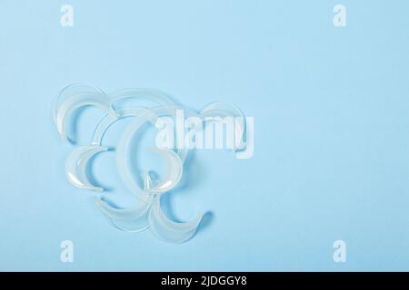 set of several Retractor Dental lip retractor Access to the oral cavity. Wide mouth opening for a dental procedure on a blue background Stock Photo