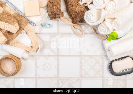 Bath accessories on a white background, top view, copy space. Daily body care concept, organic bath products. washcloth, towel, soap Stock Photo