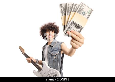 Young man in a denim vest with an electric guitar showing a blank card in front of camera isolated on white background Stock Photo