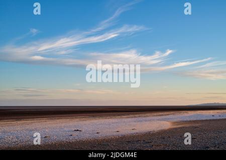 Sand and cockle shells on a windy evening at sunset.  Southerness Beach, Dumfries and Galloway, Scotland Stock Photo