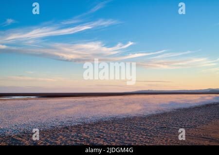 Sand and cockle shells on a windy evening at sunset.  Southerness Beach, Dumfries and Galloway, Scotland Stock Photo