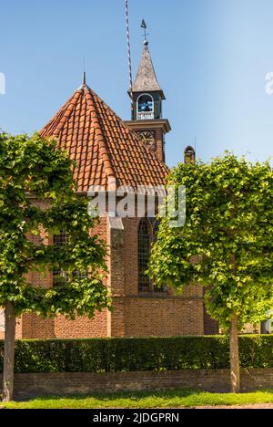Enkhuizen, Netherlands, June 2022. Street with canal and old historic houses in Enkhuizen, Holland. High quality photo Stock Photo
