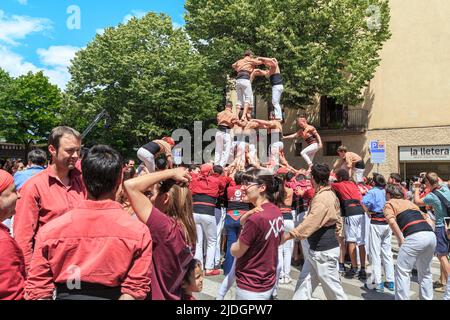 GIRONA, SPAIN - MAY 14, 2017: This is the construction of a tower of people, called castel, during the city the Flower Festival. Stock Photo