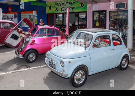 Two tiny 'bubble cars', a 1969 Fiat Saloon 500 (front) and 1963 BMW Isetta (rear) on display at a classic car show. Tauranga, New Zealand Stock Photo