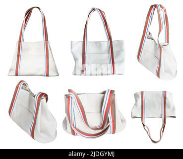 set of handcrafted tote bags from white leather and with wide cotton strap handles cut out on white background Stock Photo