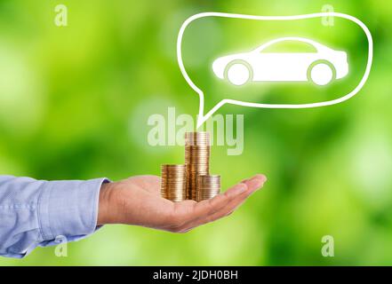 Close up photo of stacked coins and car as a symbol of vehicle buy. Concept of buying dream car. Stock Photo