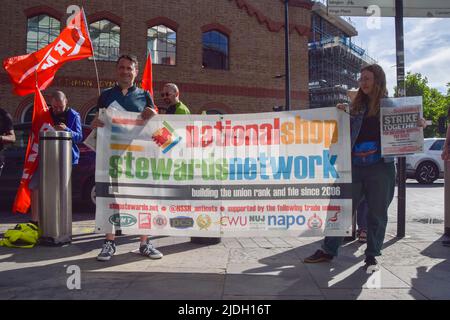 London, UK. 21st June 2022. Strikers hold a National Shop Stewards Network banner outside St Pancras International Station, as the biggest nationwide rail strike in 30 years hits the UK. Credit: Vuk Valcic/Alamy Live News Stock Photo