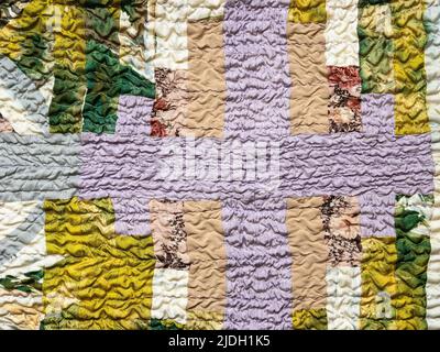 handcrafted pattern of crinkled patchwork sllk scarf close up Stock Photo