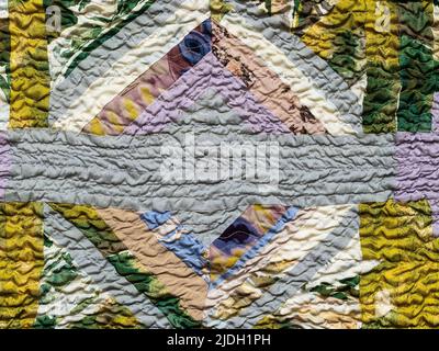 handcrafted geometric ornament of crinkled patchwork sllk scarf Stock Photo