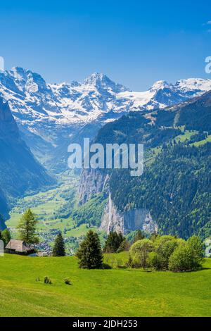 Scenic summer view over Lauterbrunnen Valley with Jungfrau and Breithorn snowy peaks, Wengen, Canton of Bern, Switzerland Stock Photo