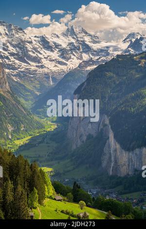 Scenic summer view over Lauterbrunnen Valley with Jungfrau and Breithorn snowy peaks, Wengen, Canton of Bern, Switzerland Stock Photo