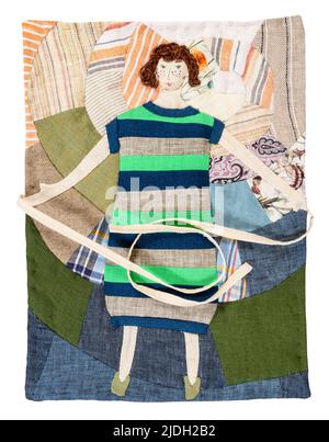 handcrafted patchwork pillowcase with ties with embroidery of woman in striped dress cutout on white background Stock Photo