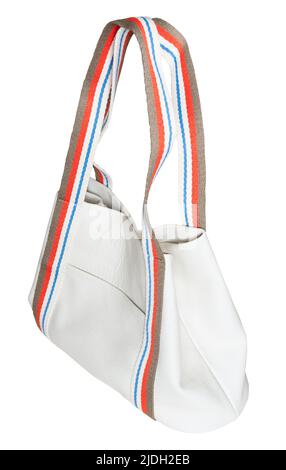 side view of handcrafted tote bag with pocket from white leather and with wide cotton strap handles cut out on white background Stock Photo