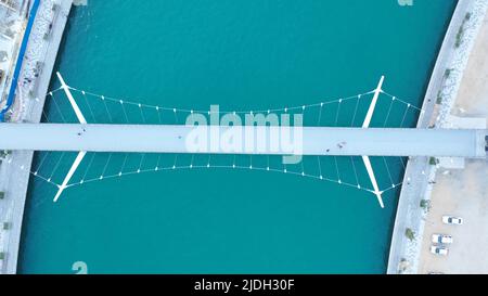 Aerial drone top view to Dubai canal and a bridge on sunrise, United Arab Emirates, Middle East Stock Photo