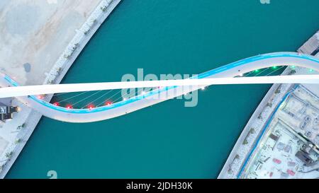 Aerial drone top view to Dubai canal and the Tolerance bridge on sunrise, United Arab Emirates, Middle East Stock Photo