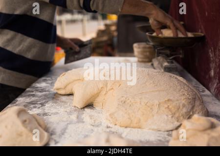 mass of yeast dough in the bakery Stock Photo - Alamy