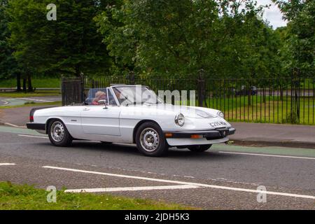 1986 80s eighties White Alfa Romeo Spider 2000cc sports tourer; automobiles featured during the 58th year of the Manchester to Blackpool Touring Assembly for Veteran, Vintage, Classic and Cherished cars. Stock Photo