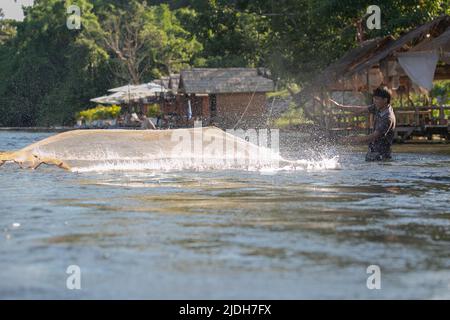 (220621) -- VIENTIANE, June 21, 2022 (Xinhua) -- A man fishes in the Nam Lik River, in Muang Fueng, a rising tourist town some 100 km north of Lao capital Vientiane, June 17, 2022. (Photo by Kaikeo Saiyasane/Xinhua) Stock Photo