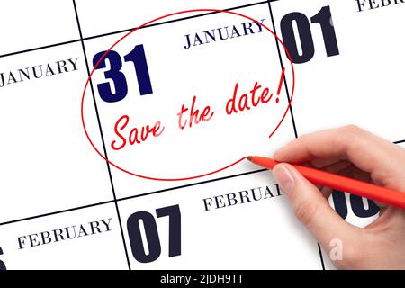 31st day of January. Hand drawing red line and writing the text Save the date on calendar date January 31.  Winter month, day of the year concept. Stock Photo