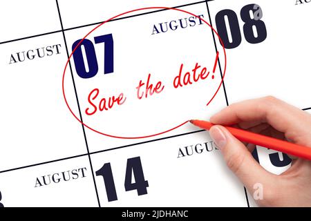 7th day of August. Hand drawing red line and writing the text Save the date on calendar date August 7.  Summer month, day of the year concept. Stock Photo