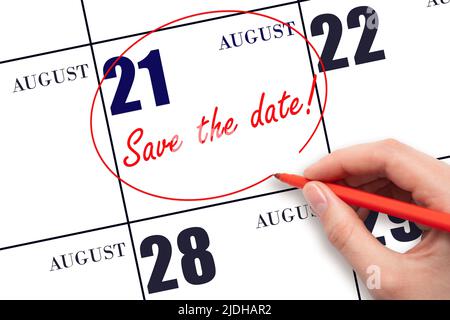 21st day of August. Hand drawing red line and writing the text Save the date on calendar date August 21.  Summer month, day of the year concept. Stock Photo