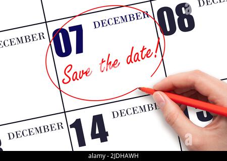 7th day of December. Hand drawing red line and writing the text Save the date on calendar date December 7.  Winter month, day of the year concept. Stock Photo