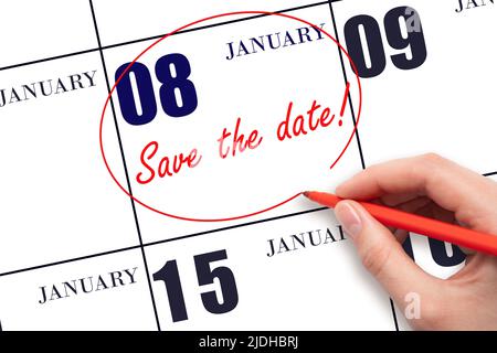 8th day of January. Hand drawing red line and writing the text Save the date on calendar date January 8.  Winter month, day of the year concept. Stock Photo